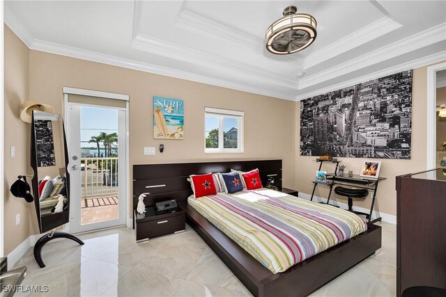 bedroom featuring access to exterior, a tray ceiling, and crown molding