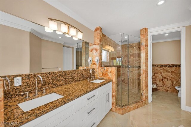 bathroom with toilet, an enclosed shower, and ornamental molding