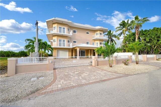 view of front facade with a balcony and a garage