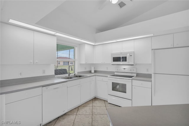 kitchen featuring lofted ceiling, sink, white cabinets, and white appliances