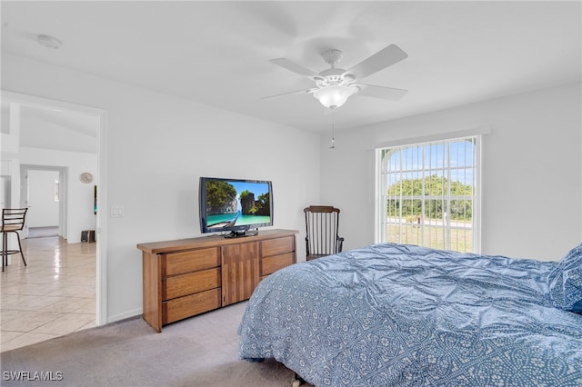 bedroom with light colored carpet and ceiling fan