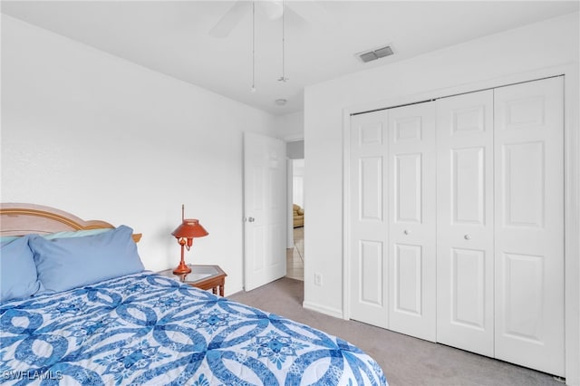 bedroom with a closet, ceiling fan, and carpet