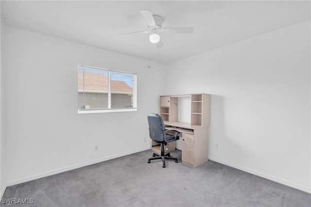 unfurnished office featuring light colored carpet and ceiling fan