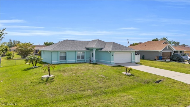 ranch-style house with a garage and a front lawn