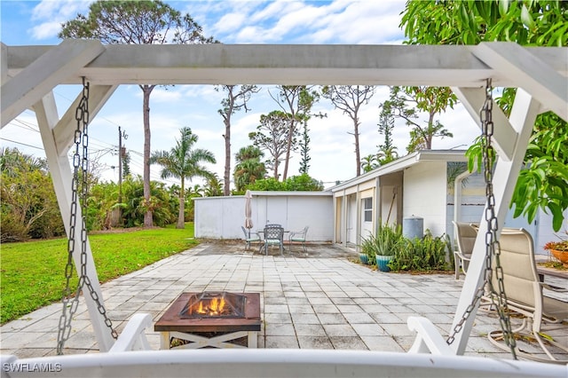 view of patio / terrace with a fire pit