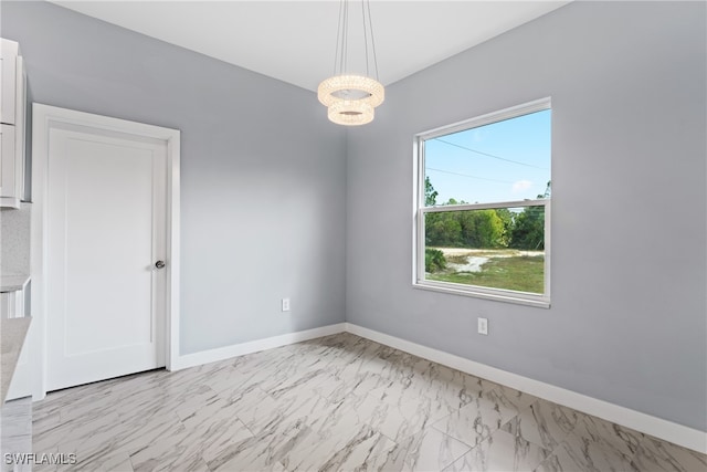 empty room with a chandelier