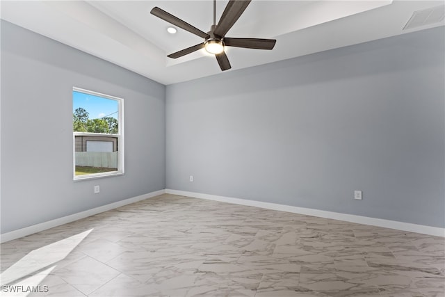 spare room with ceiling fan