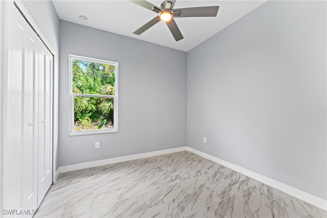 unfurnished bedroom featuring a closet and ceiling fan