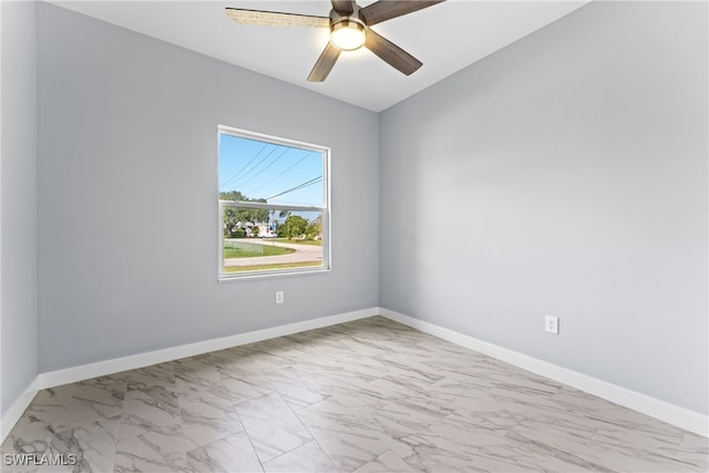 spare room with ceiling fan