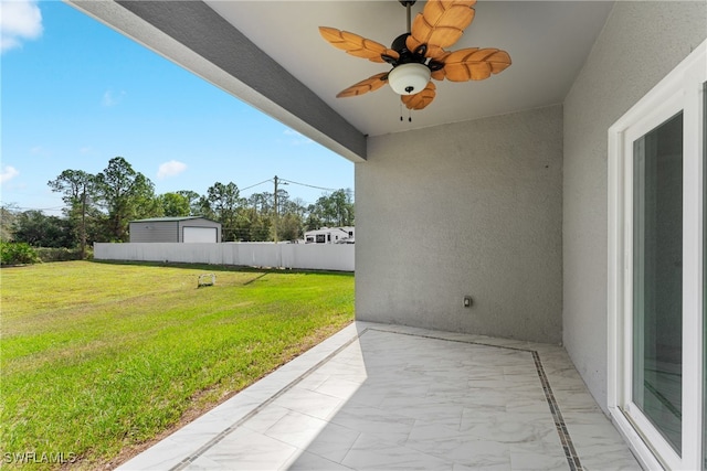 view of patio featuring ceiling fan