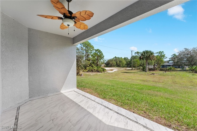 view of yard with a patio and ceiling fan