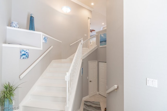 stairway with tile patterned floors