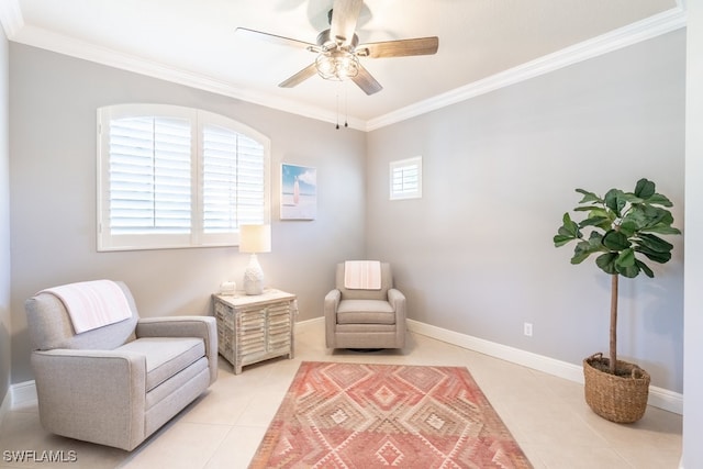 sitting room with ceiling fan, light tile patterned floors, and ornamental molding