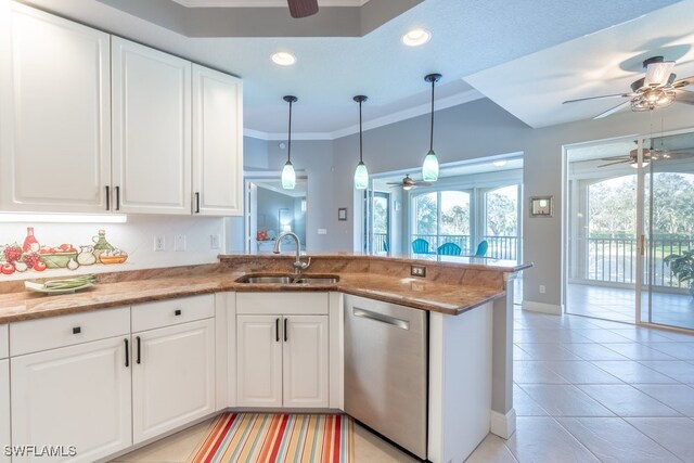 kitchen with white cabinets, kitchen peninsula, sink, light tile patterned floors, and stainless steel dishwasher