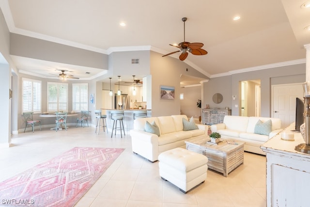 tiled living room with ornamental molding and lofted ceiling