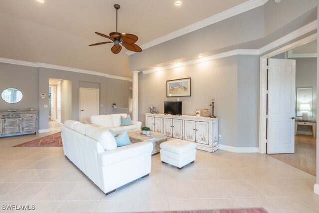 tiled living room featuring a high ceiling, ceiling fan, and ornamental molding