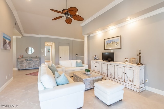 tiled living room featuring ceiling fan, ornate columns, and crown molding