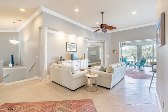 living room with decorative columns, light tile patterned floors, ceiling fan, and crown molding