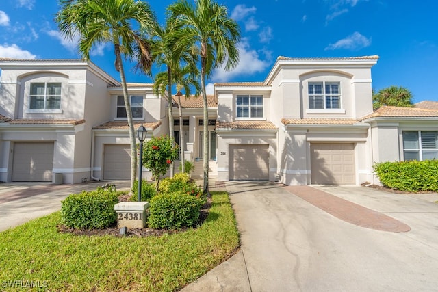 mediterranean / spanish-style home featuring a garage