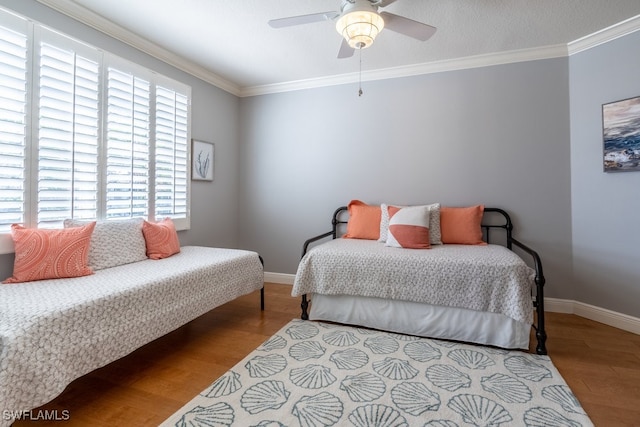 bedroom with light wood-type flooring, multiple windows, and ceiling fan