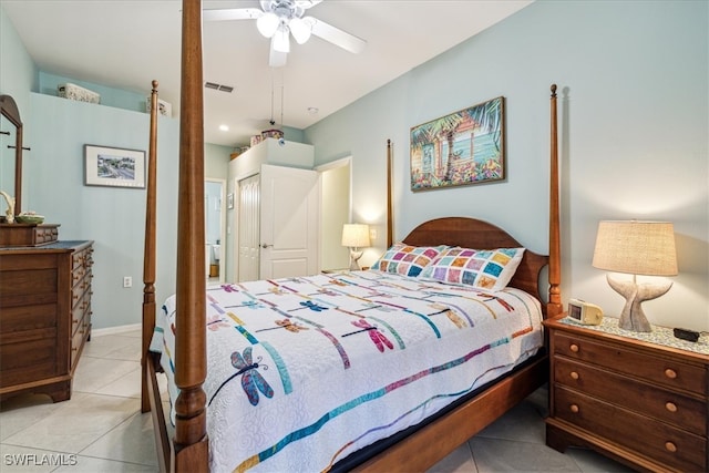 bedroom featuring a closet, ceiling fan, and light tile patterned floors