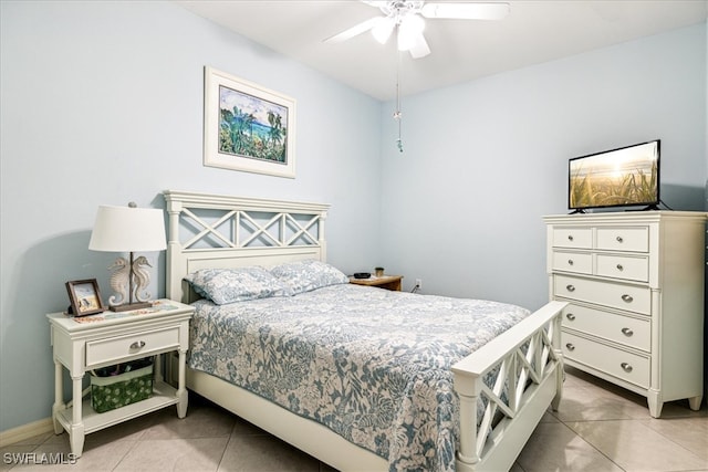 bedroom featuring light tile patterned floors and ceiling fan