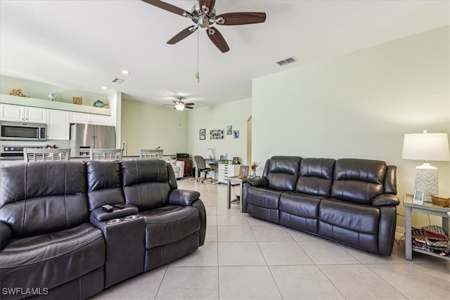 living room featuring ceiling fan and light tile patterned floors