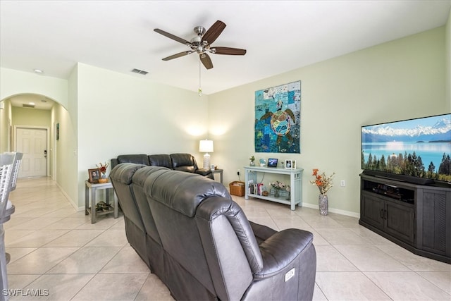 living room with light tile patterned flooring and ceiling fan