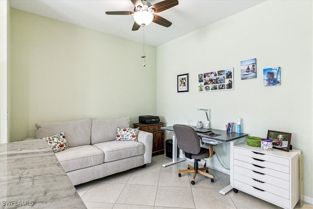 office area with light tile patterned flooring and ceiling fan