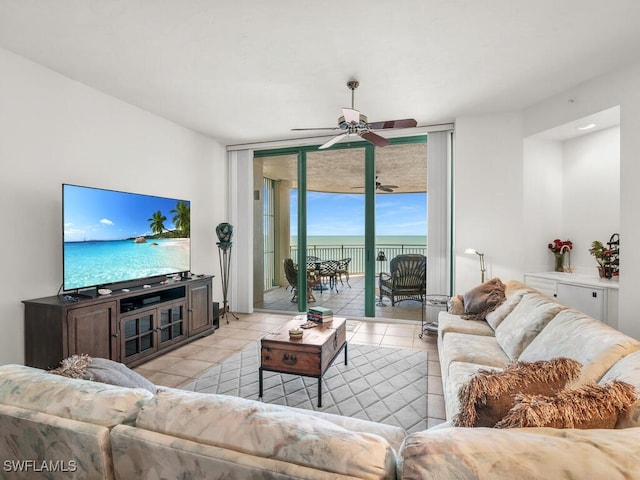 living room featuring light tile patterned flooring and ceiling fan