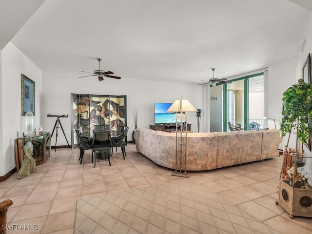 tiled living room with ceiling fan