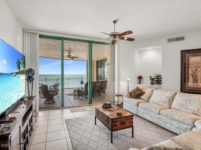 living room with light tile patterned flooring and ceiling fan