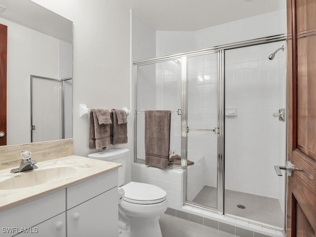 bathroom featuring vanity, an enclosed shower, toilet, and tile patterned floors