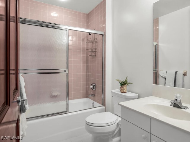 full bathroom featuring vanity, toilet, and enclosed tub / shower combo