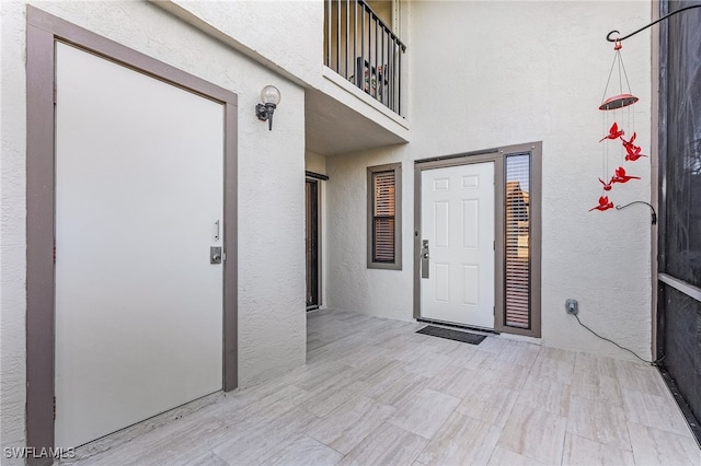 entrance to property with a balcony