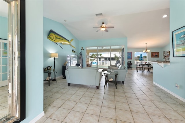 tiled living room featuring ceiling fan with notable chandelier and lofted ceiling