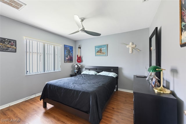 bedroom featuring dark wood-type flooring and ceiling fan