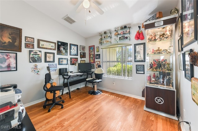 office space featuring lofted ceiling, ceiling fan, and light hardwood / wood-style flooring