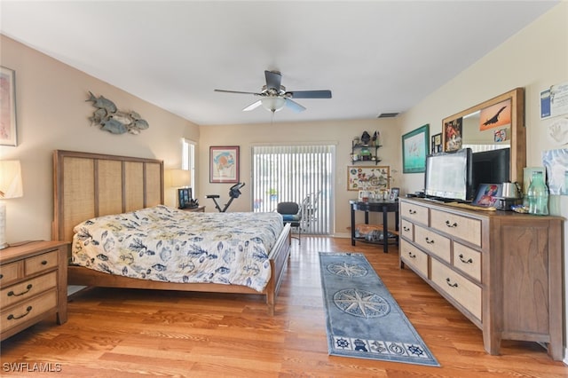 bedroom with light hardwood / wood-style floors and ceiling fan