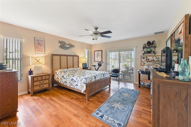 bedroom with access to outside, light hardwood / wood-style floors, and ceiling fan