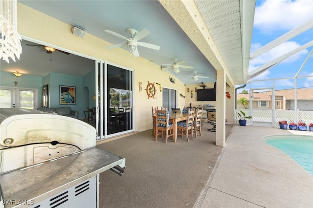 view of patio with a lanai and ceiling fan