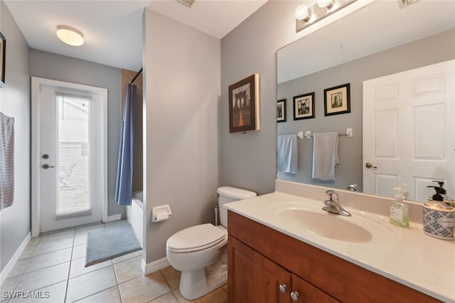 full bathroom featuring shower / bath combo, tile patterned flooring, vanity, and toilet