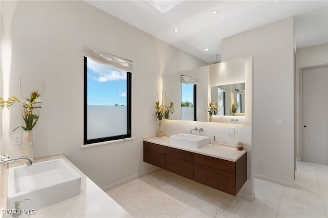 bathroom featuring tile patterned flooring and vanity