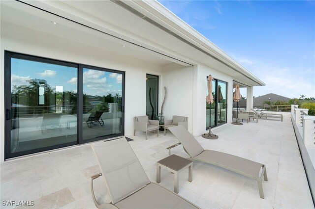 view of patio / terrace with a balcony