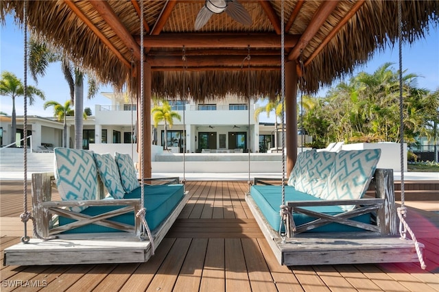 deck with a gazebo and ceiling fan