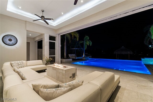 view of pool featuring ceiling fan