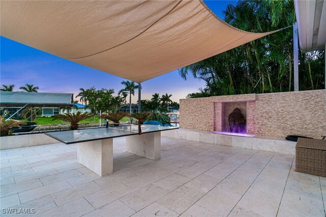 view of patio terrace at dusk