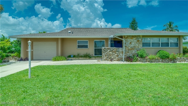 single story home with a garage and a front yard