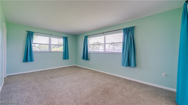 empty room featuring carpet flooring