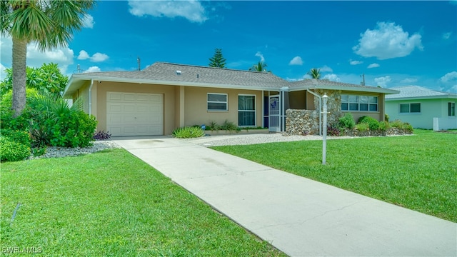 ranch-style home featuring a front yard and a garage